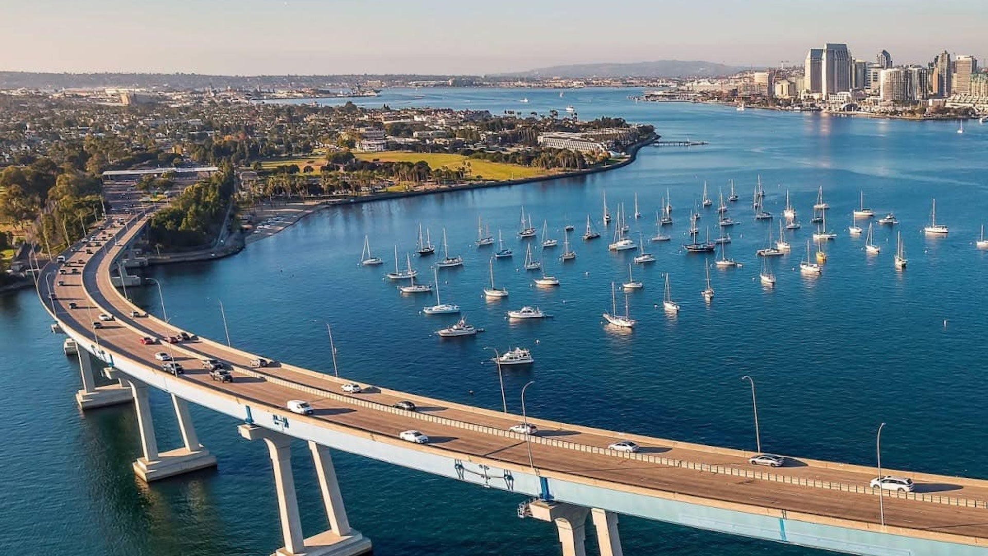 Coronado Bridge crossing San Diego Bay with sailboats and the downtown skyline